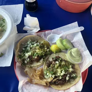 Steak tacos with everything with a Mexican Coke