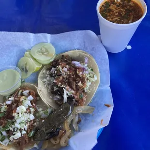 Birria taco, asada taco &amp; consommé, topped w/ onion, cilantro &amp; cabbage. All that was missing was a really spicy sauce. Overall good flavor