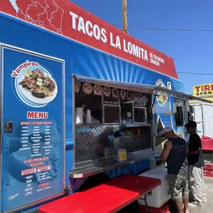 people ordering food from a food truck