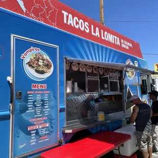 people ordering food from a food truck