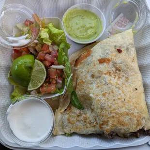 Super quesadilla: avo, cream, pico de gallo and lime. Also come with small bag of chips!