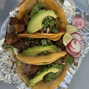 Carnitas, chorizo, al pastor tacos
