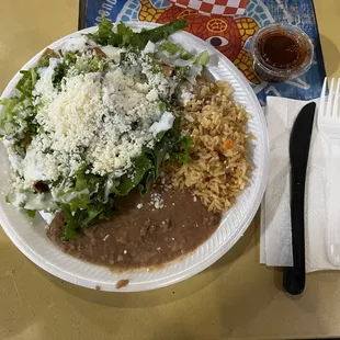 Flautas meal - Rice, beans, and 6 flautas topped with lots of lettuce and cheese.