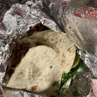 a taco wrapped in foil
