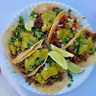 Tacos Carne asadas with spicy sauce (Green) and tacos al pastor with spicy sauce