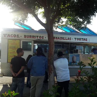 people ordering food from a food truck