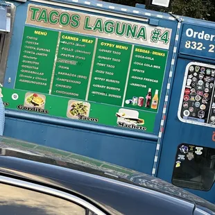 a taco truck with menus