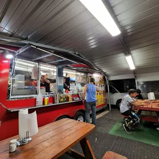 people ordering food from a food truck