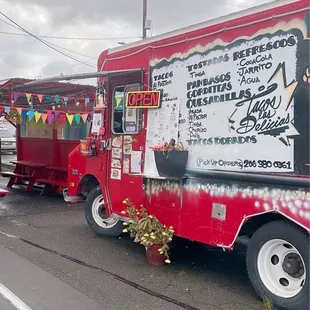 a taco truck parked on the side of the road