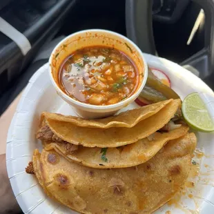 This is an order of quesabirrias with consomé . Order has 3 quesabirrias and 1 cup of consomé