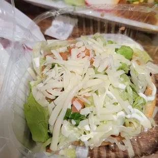 a taco in a plastic container