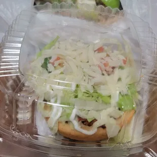 a taco in a plastic container