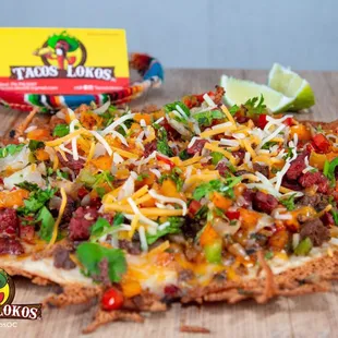 a tortilla topped with cheese and vegetables