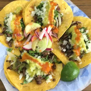 a plate of tacos on a napkin