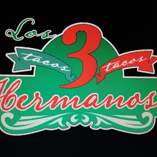 a tacos 3 hermanos sign