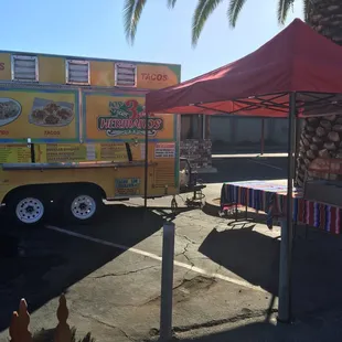 a taco truck parked in a parking lot