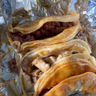 Chorizo, asado and chicken tacos.