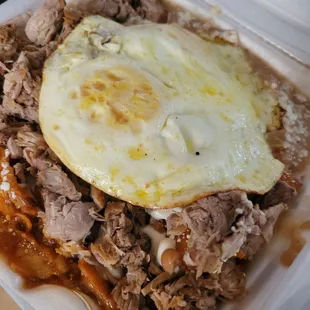 Red Chilaquiles with carnitas (carnitas available on the weekends)    Photo Cred: @_eatingwithrunana
