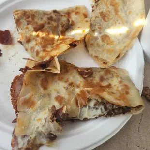three quesadillas on a plate