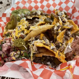 Carne Asada Nachos... 4stars. I wish the meat was larger.  They had fresh salsa, guacamole &amp; refried beans, at corners.