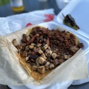 Pork belly and chorizo queso tacos