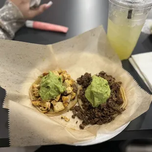 two tacos with guacamole