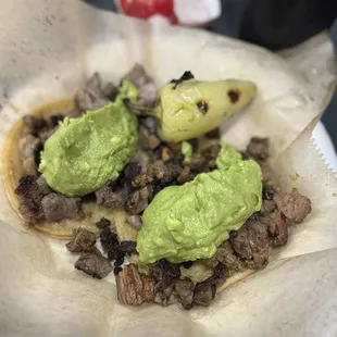 a taco with guacamole