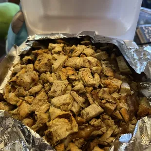 The papa and cheese is under all that chicken