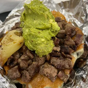 Papa loca with ribeye and guacamole