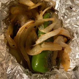 onions and peppers wrapped in foil