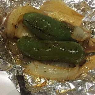 Grilled onions and jalapeños. Ask for them when you get your order. DON'T FORGET!!! Trust me. :)