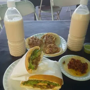 Tacos de carnitas, taco de pastor, Torta de asada, and two horchatas. So friggin' good!