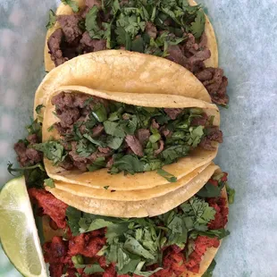 Fajita and pastor tacos on corn