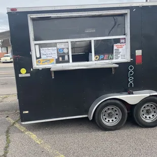 a taco truck parked in a parking lot