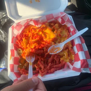 Hot Cheetos with nachos cheese and jalapeños