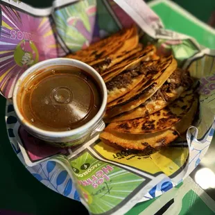 Order of taco Tijuana (quesabirrias) served with consomé on the side