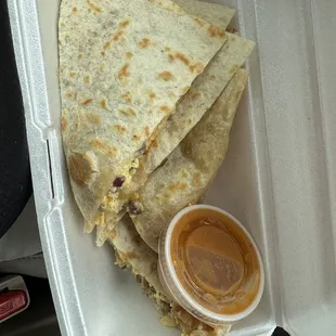 Sausage breakfast quesadilla: Fresh tortillas, lots a cheese, and a spicy touch with that sauce