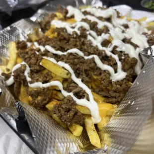 Papas preparadas con queso y carne