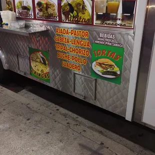 a taco truck parked on the side of the road