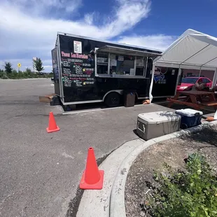 a taco truck parked in a parking lot