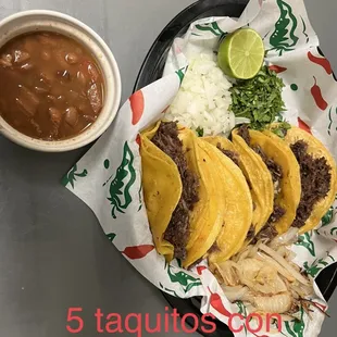 a plate of tacos and salsa