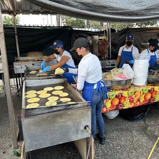 a group of people preparing food