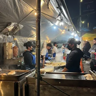 a group of people preparing food