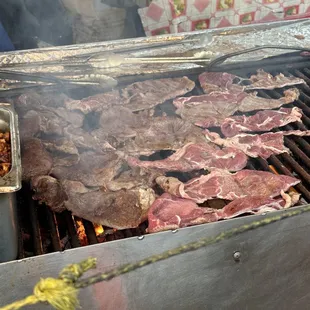 meat cooking on a grill