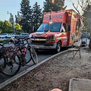 the truck, with lighting and chairs nearby