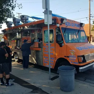 people ordering food from a food truck