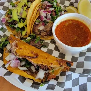 Left to right, asada taco and lengua taco. Bottom taco is the quesabirria