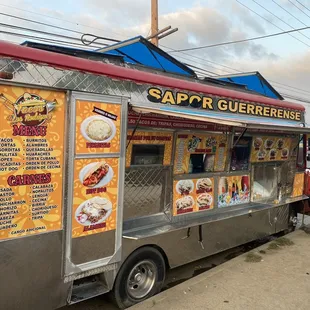 a food truck parked on the side of the road