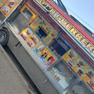 a food truck parked on the side of the road