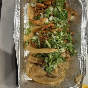 Al pastor taco , chicharrone taco